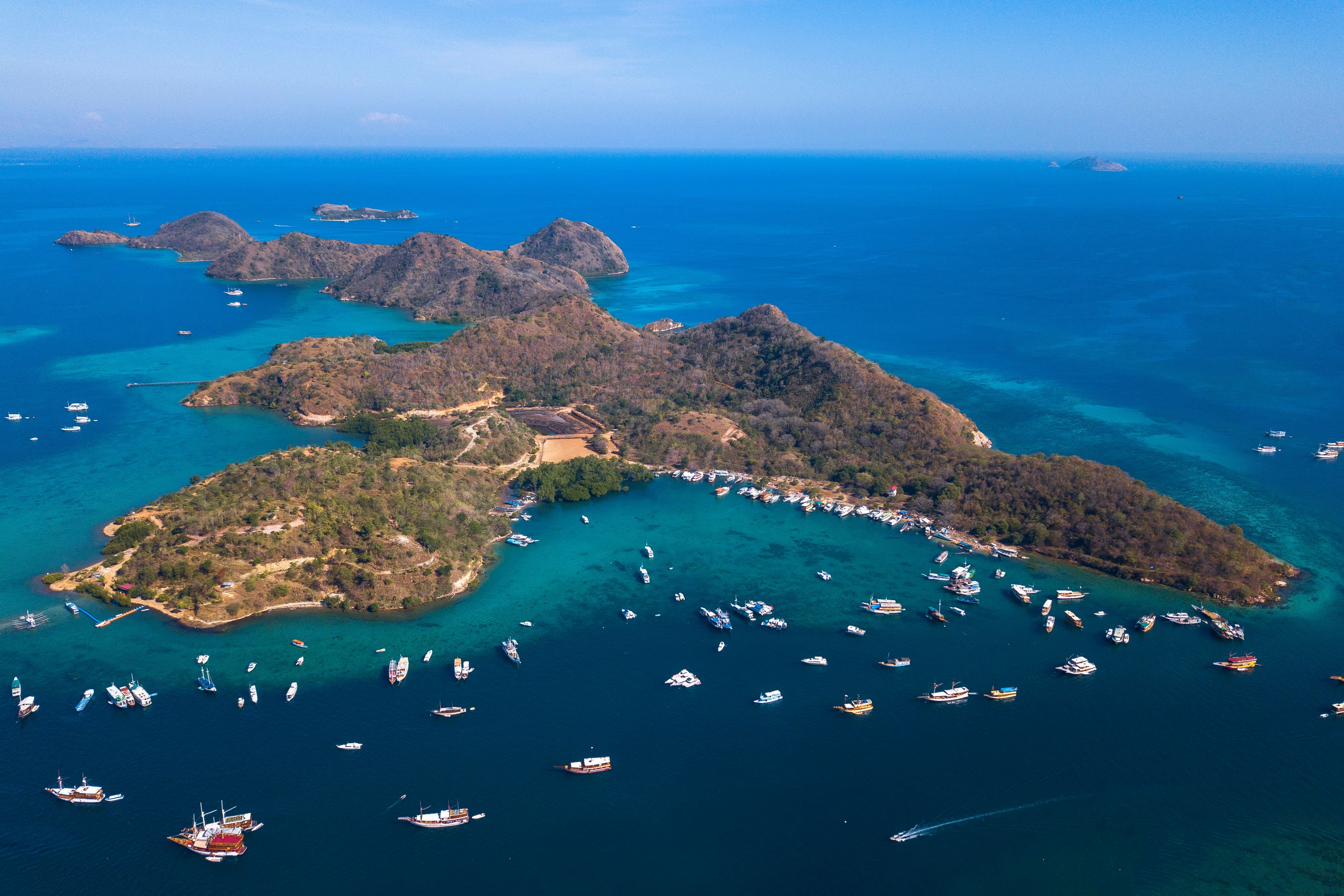 Dramatic volcanic islands rising from turquoise waters of Komodo