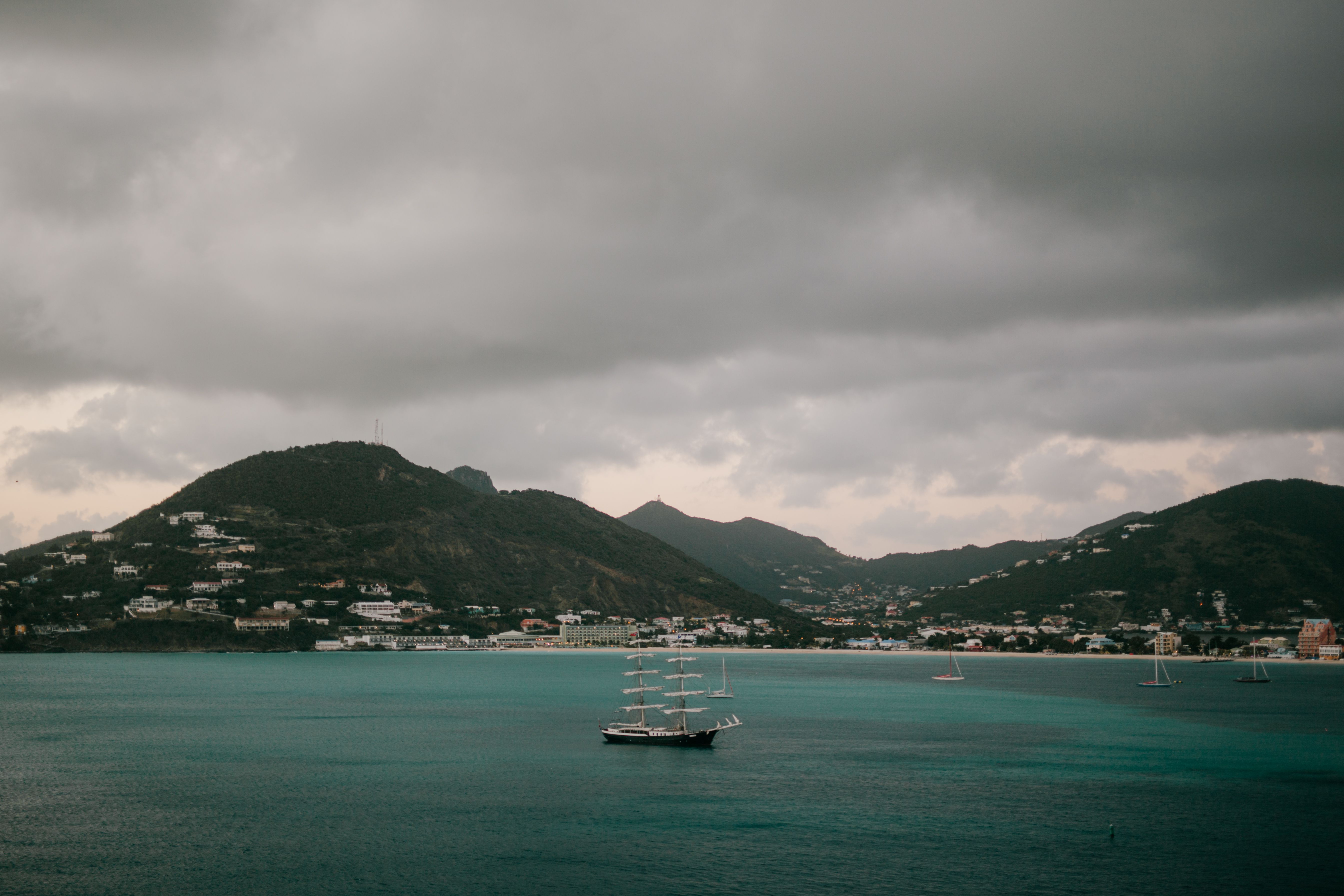 Colorful harbor and sailboats with crystal clear waters of St. Martin