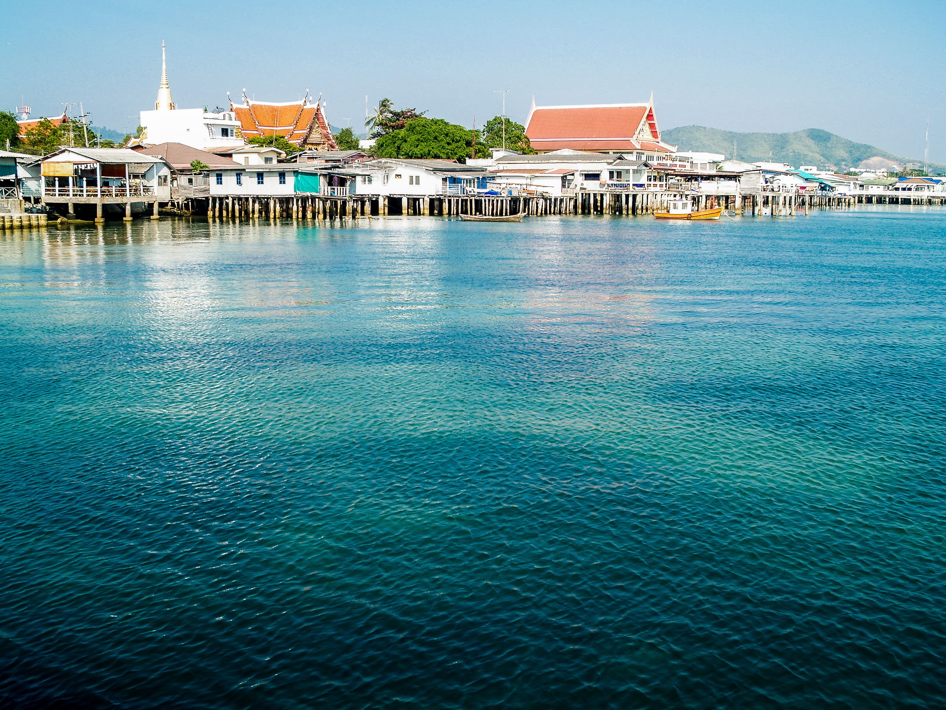 Dramatic limestone karst islands rising from turquoise waters in Thailand